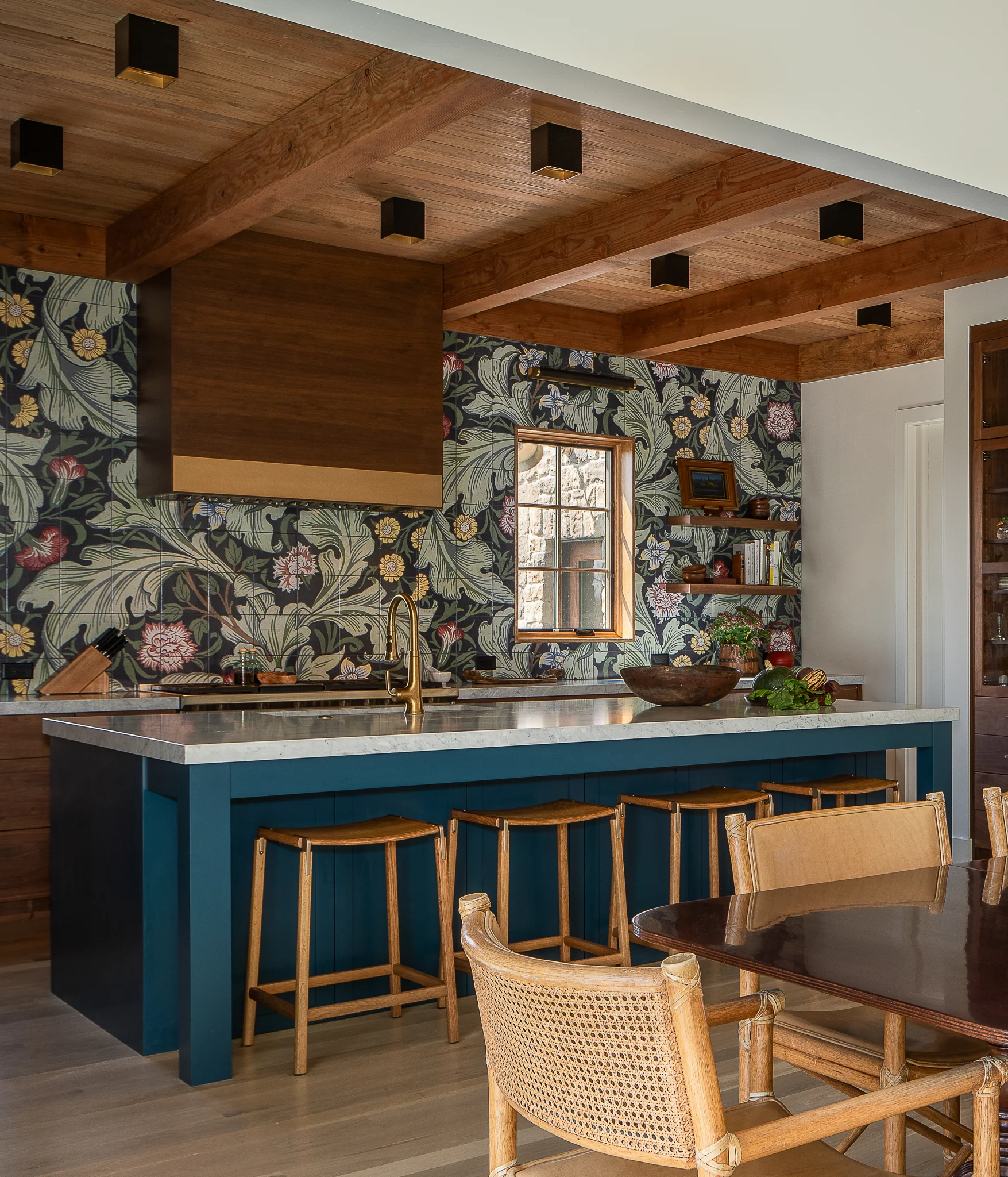 Kitchen island detail with dining table in the foreground — interior design photography Driggs Idaho, River's Edge